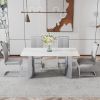 Modern minimalist dining table. White imitation marble glass sticker desktop, stainless steel legs, stable and beautiful. Suitable for living room and