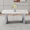 Modern minimalist dining table. White imitation marble glass sticker desktop, stainless steel legs, stable and beautiful. Suitable for living room and